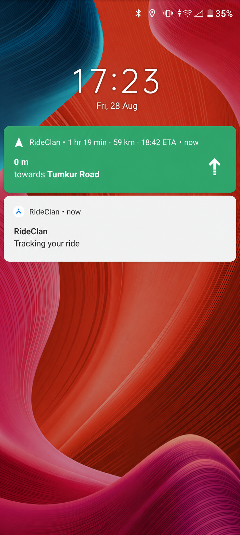 Phone lock screen showing RideClan still tracking the ride in the background